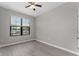 Spacious bedroom with grey walls and laminate wood flooring at 5111 Lazio St, Saint Cloud, FL 34771