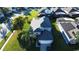 Aerial view of a two-story house with a gray roof and a two-car garage at 2214 Wyndham Palms Way, Kissimmee, FL 34747