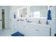 Modern bathroom with double vanity and large mirrors at 2214 Wyndham Palms Way, Kissimmee, FL 34747