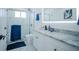 Modern bathroom with white cabinets, granite countertop, and walk-in shower at 2214 Wyndham Palms Way, Kissimmee, FL 34747