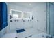 Elegant bathroom with double sinks, marble countertops, and modern fixtures at 2214 Wyndham Palms Way, Kissimmee, FL 34747