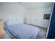 Bright bedroom with white dresser and blue bedding at 2214 Wyndham Palms Way, Kissimmee, FL 34747