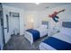 ' bedroom with twin beds, blue accents, and playful superhero wall decals at 2214 Wyndham Palms Way, Kissimmee, FL 34747