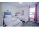 ' bedroom with twin beds, pink accents, and Minnie Mouse wall decals at 2214 Wyndham Palms Way, Kissimmee, FL 34747