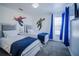 ' bedroom with twin beds, blue accents, and playful superhero wall decals at 2214 Wyndham Palms Way, Kissimmee, FL 34747