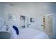 Main bedroom with white furniture and ensuite bathroom access at 2214 Wyndham Palms Way, Kissimmee, FL 34747