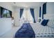 Comfortable bedroom with king-size bed and views to the patio and kitchen at 2214 Wyndham Palms Way, Kissimmee, FL 34747