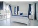 Spacious primary bedroom with a king-size bed and private access to the patio at 2214 Wyndham Palms Way, Kissimmee, FL 34747