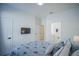 Bedroom with a queen bed, en-suite bathroom, and flat-screen TV at 2214 Wyndham Palms Way, Kissimmee, FL 34747