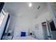 Bedroom with white furniture, blue accents, and large window with blinds at 2214 Wyndham Palms Way, Kissimmee, FL 34747