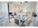 Open concept dining area with glass table and view to kitchen at 2214 Wyndham Palms Way, Kissimmee, FL 34747