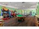 Game room with arcade games, pool table, and ping pong at 2214 Wyndham Palms Way, Kissimmee, FL 34747