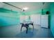 Spacious garage with air hockey table and refrigerator at 2214 Wyndham Palms Way, Kissimmee, FL 34747