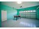 Garage with air hockey table and overhead door at 2214 Wyndham Palms Way, Kissimmee, FL 34747