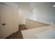 Upstairs hallway with carpet and access to bedrooms at 2214 Wyndham Palms Way, Kissimmee, FL 34747