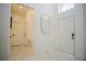 Clean and bright hallway with white doors and tile flooring at 2214 Wyndham Palms Way, Kissimmee, FL 34747