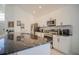 Kitchen with granite island, stainless steel appliances, and white cabinets at 2214 Wyndham Palms Way, Kissimmee, FL 34747