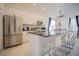 Modern kitchen with granite countertops and stainless steel appliances at 2214 Wyndham Palms Way, Kissimmee, FL 34747