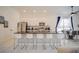 Open concept kitchen with island seating and stainless steel appliances at 2214 Wyndham Palms Way, Kissimmee, FL 34747