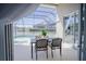 Relaxing pool area with patio furniture and screened enclosure at 2214 Wyndham Palms Way, Kissimmee, FL 34747
