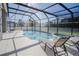 Relaxing pool and spa with lounge chairs at 2214 Wyndham Palms Way, Kissimmee, FL 34747