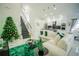 Bright and airy living room with a sectional sofa and Christmas tree at 8048 King Palm Cir, Kissimmee, FL 34747