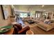 Spacious living room featuring a sectional sofa, fireplace, and ample natural light at 245 Lake Seminary Cir, Maitland, FL 32751