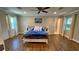 Serene bedroom with a queen-size bed and wood-look flooring at 245 Lake Seminary Cir, Maitland, FL 32751