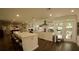 Spacious kitchen featuring a large island, white cabinetry, and modern appliances at 245 Lake Seminary Cir, Maitland, FL 32751