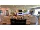 Open living area with sectional sofa, fireplace, and large TV at 245 Lake Seminary Cir, Maitland, FL 32751