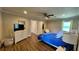 Bright bedroom with a queen bed, dresser, and large window at 245 Lake Seminary Cir, Maitland, FL 32751