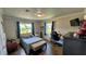 Bright bedroom with a comfy bed, built-in workspace, and wood-look floors at 245 Lake Seminary Cir, Maitland, FL 32751