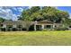 Charming ranch home with mature landscaping and a spacious yard at 245 Lake Seminary Cir, Maitland, FL 32751