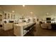 Modern kitchen with a center island, white cabinets, and stainless steel appliances at 245 Lake Seminary Cir, Maitland, FL 32751