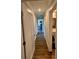 Long hallway with wood flooring and access to bedrooms and bathroom at 245 Lake Seminary Cir, Maitland, FL 32751