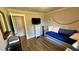 Small bedroom with daybed, dresser, and wood flooring at 245 Lake Seminary Cir, Maitland, FL 32751