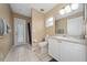 Bathroom with toilet, vanity, and exterior access at 344 Barbera Dr, Davenport, FL 33897