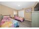 Bedroom with two twin beds, dresser, and Disney princess theme at 344 Barbera Dr, Davenport, FL 33897