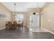 Bright dining room features a chandelier and wood flooring at 344 Barbera Dr, Davenport, FL 33897