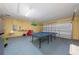 Garage with ping pong table and storage at 344 Barbera Dr, Davenport, FL 33897