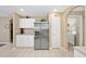 Spacious kitchen with stainless steel appliances and white cabinetry at 344 Barbera Dr, Davenport, FL 33897