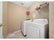Laundry room with washer, dryer, and shelving at 344 Barbera Dr, Davenport, FL 33897