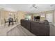 Spacious living room with a sectional sofa and adjacent dining area at 344 Barbera Dr, Davenport, FL 33897