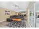 Living room with large sectional sofa, coffee table, and access to the outdoors at 344 Barbera Dr, Davenport, FL 33897