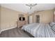 Main bedroom with dresser, TV and a bed with gray laminate floors at 344 Barbera Dr, Davenport, FL 33897