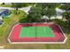 Aerial view of a community tennis court with green playing surface and red boundary at 344 Barbera Dr, Davenport, FL 33897