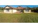 House exterior features a brown roof, light-colored siding, and a front porch at 10181 Sw 46 Ct, Ocala, FL 34476