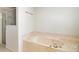 Bathroom with soaking tub and shower at 10181 Sw 46 Ct, Ocala, FL 34476