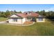 Single-story home with a large yard and driveway at 10181 Sw 46 Ct, Ocala, FL 34476