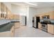 Kitchen with stainless steel appliances and light wood cabinets at 10181 Sw 46 Ct, Ocala, FL 34476
